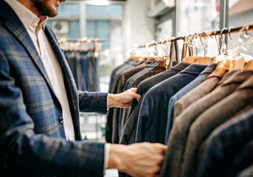 Businessman trying suit in store